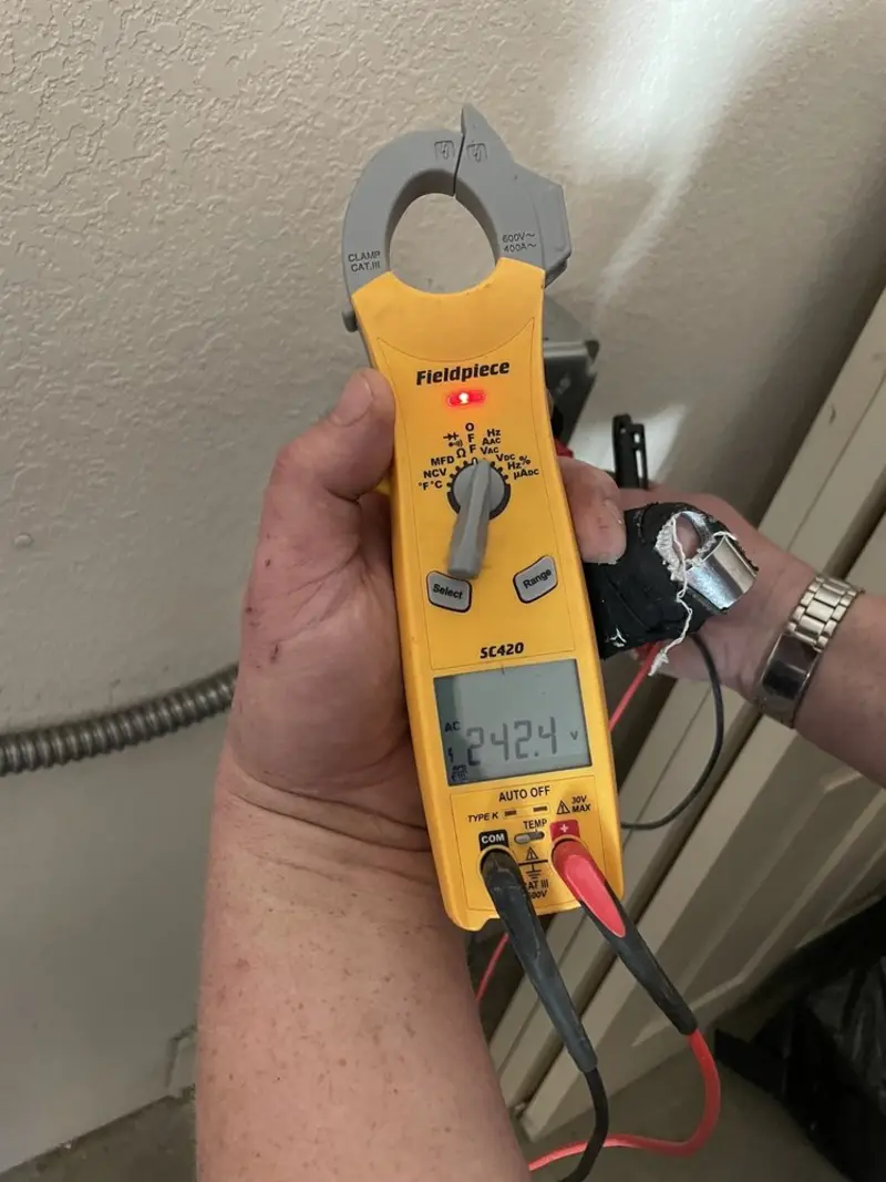 Voltage testing with clamp meter during Hot Tub / Pool Electrical Wiring in Alva